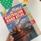 Vintage Australian Road Atlas used to make original wallets by lyssymay held by a hand on a white background