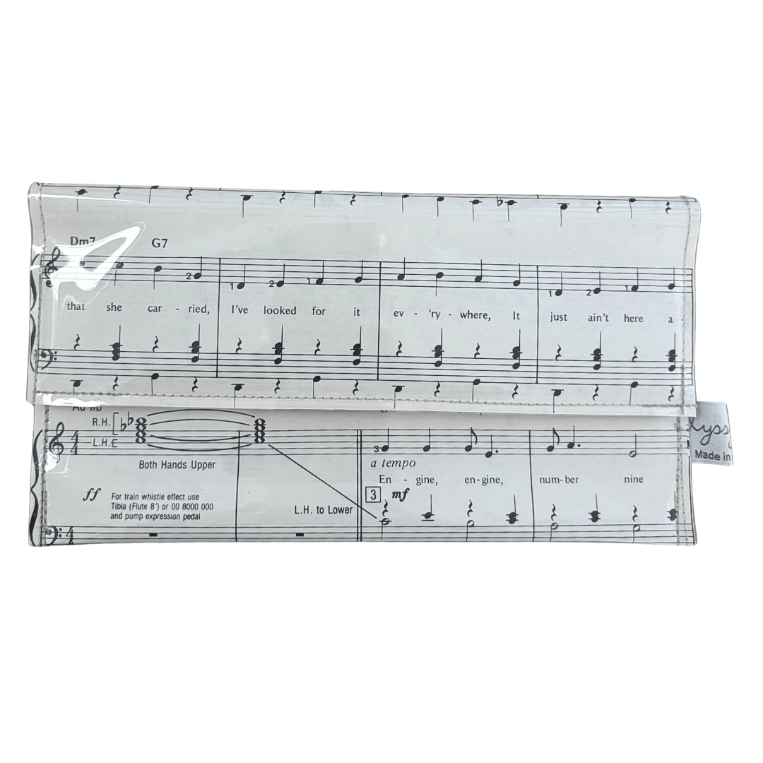 handmade wallet with music sheet design on a white background