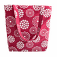A handprinted cottage garden handmade shoulder bag in white and rouge with a floral pattern on a red background.