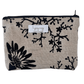Fabric pouch with black floral pattern on beige background, featuring lyssymay brand label.