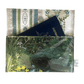 Passport holder with nature-themed design featuring a water and plants