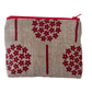 Fabric pouch with red floral patterns on a natural linen background