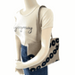 Mannequin wearing a linen tote bag with black circular pattern 