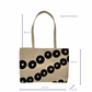 Tote bag with black circular pattern and dimensions on a white background