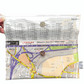 Map pouch with a printed map design on a white background