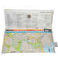 Folded map with a detailed layout of a town or city, including roads and possibly landmarks.