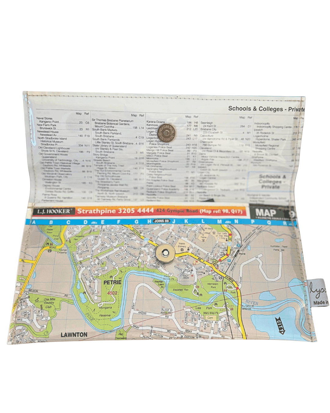 Folded map with a detailed layout of a town or city, including roads and possibly landmarks.